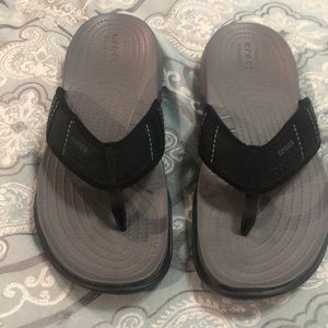 CROCS flip flops.